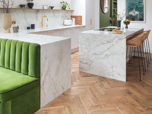 Pure Kitchen in Tusk with sintered stone worksurfaces. Photo: Kasia Fiszer. Open plan kitchen ideas.