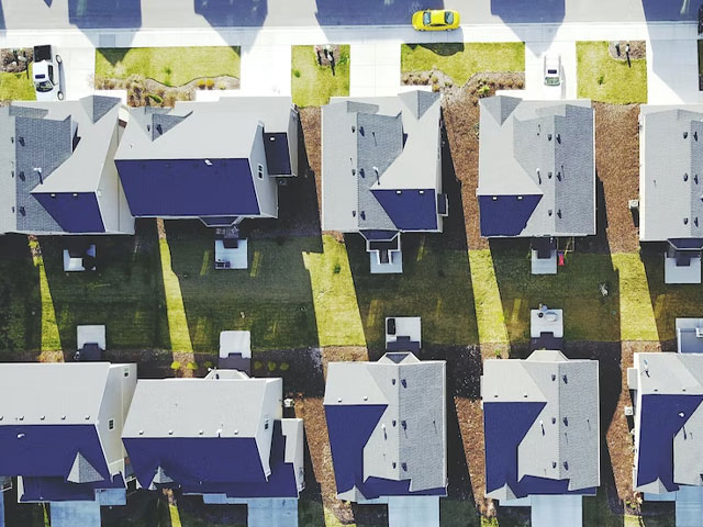 an overhead shot of a new housing development with heat pumps