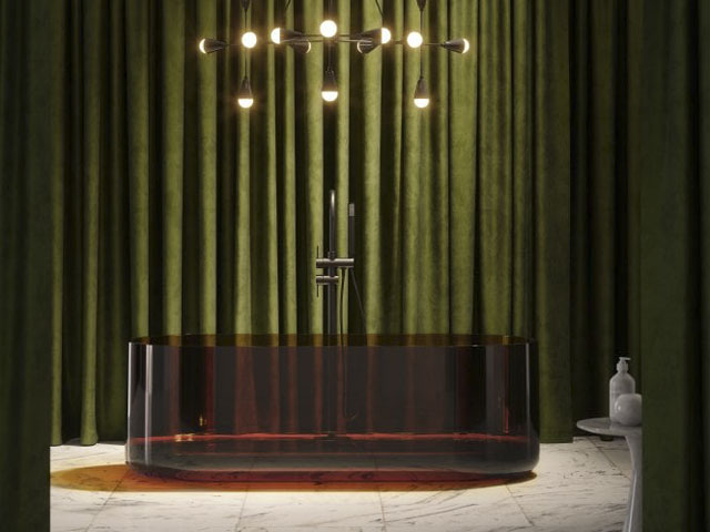 transparent amber resin freestanding bathtub in a luxury setting with green velvet curtains