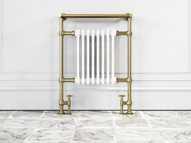floor-mounted radiator and towel warmer fusing period details with modern design, finished in a luxurious brushed gold
