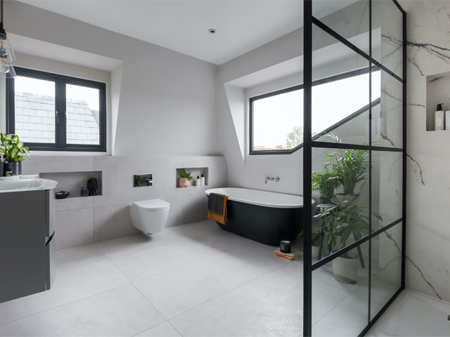 Large dormer loft bathroom with slanted window and marble shower