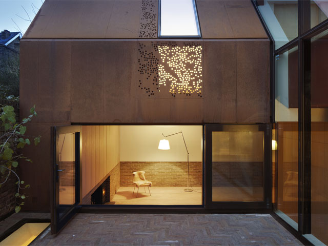 The perforated steel exterior leading to the courtyard. Photo: Piercy and Co.