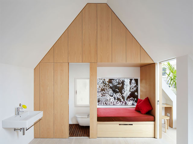 Children's bedroom and en-suite with wood panelling in the Grand Designs House of the Year shortlisted Kew House. Photo: Piercy and Co.