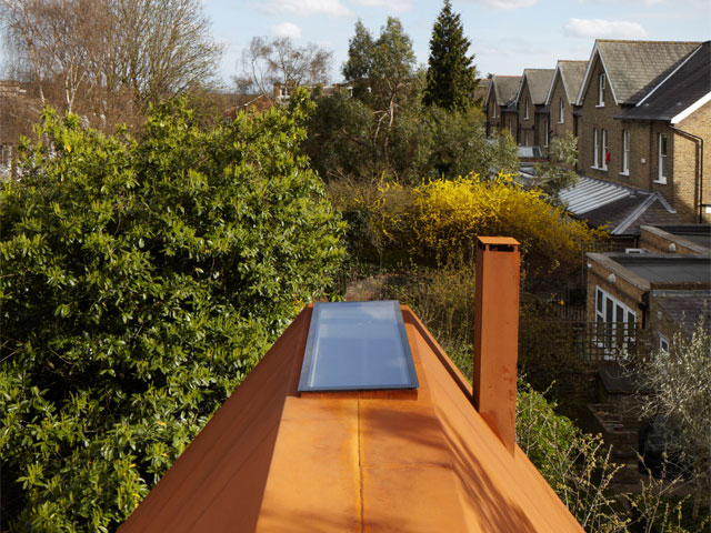 Aerial view of the corrugated steel room and treetops. Photo: Piercy and Co.