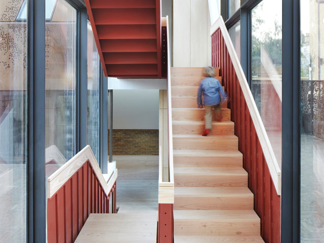 The Grand Designs Kew House red steel staircase. Photo-Piercy-and-Co-8