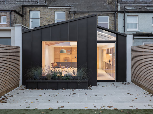 A three-bedroom house in Richmond with a contemporary aluminium-clad side and rear extension with large windows
