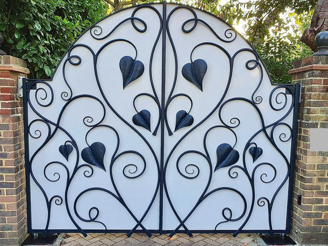 metal driveway gates with privacy screens and leaf motif