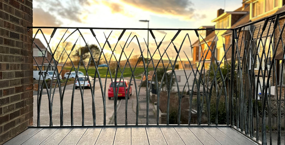 bespoke black metal balcony railings sculpted in the shape of reeds