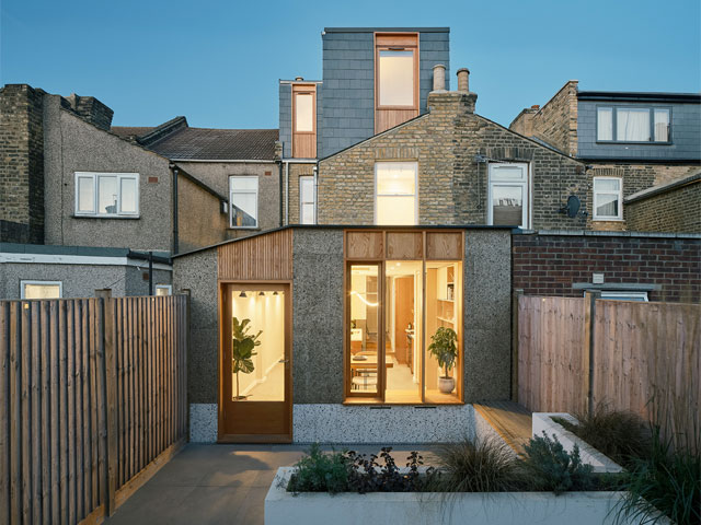 Breathable House exterior at dusk. 