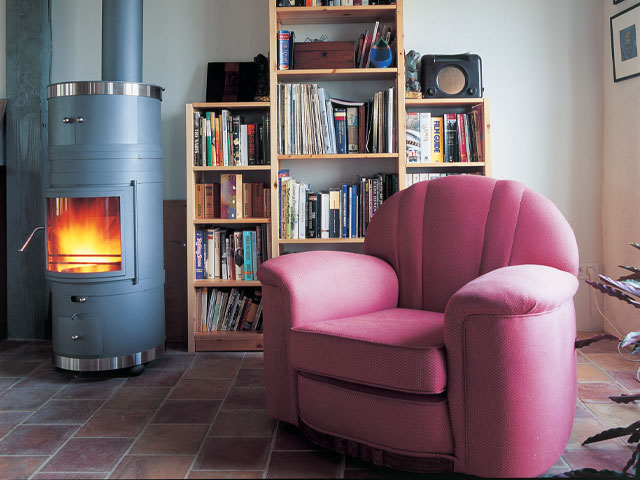 The Grand Designs French manor, wood burning stove and reading nook armchair