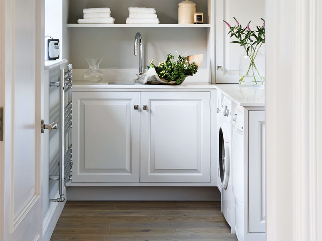 white cabinet kitchen add on with curved mixer tap and heated clothes rail wood flooring 