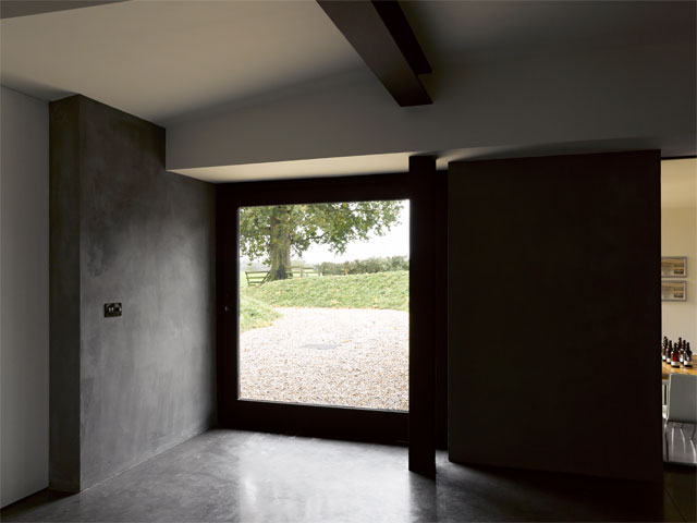 Large glass front door in the Grand Designs Two Cocks Farm