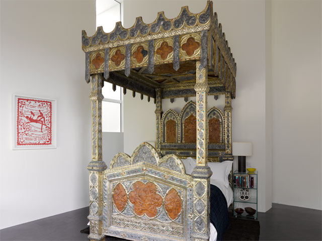 Gothic Revival four poster bed in neural coloured bedroom.
