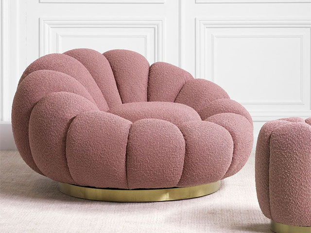 swivel chairs large pink with gold base in front of white wall