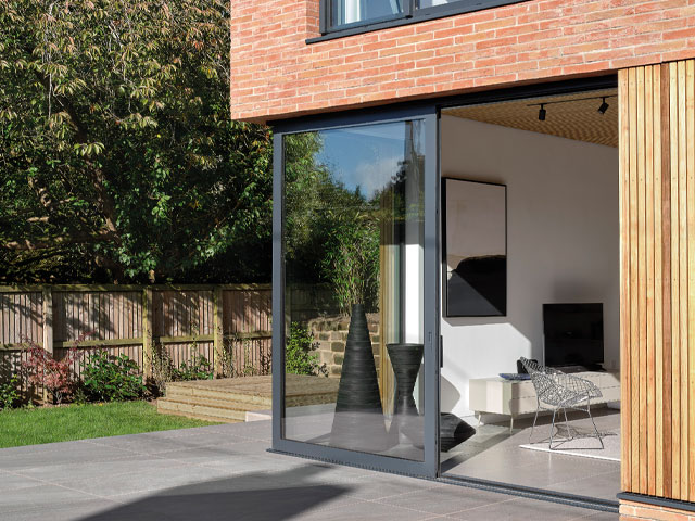Corner of home glazed corner leading to garden trees timber struts