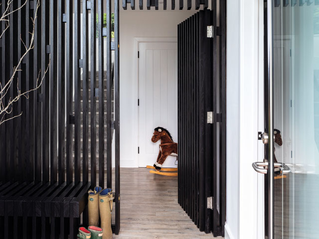 Grand Designs Leominster. Steel vertical strutted front door rocking horse wellington boots