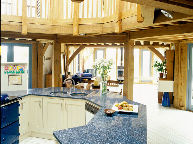 Oak framed home kitchen blue work surfaces blue aga oven 