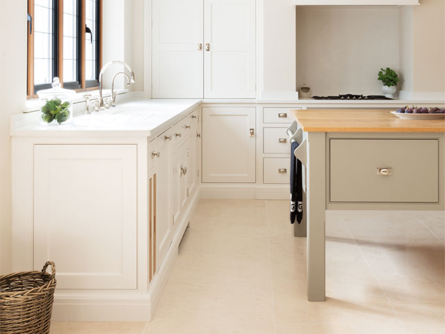 Kitchen layout. White cabinets gold fixtures wicker basket 