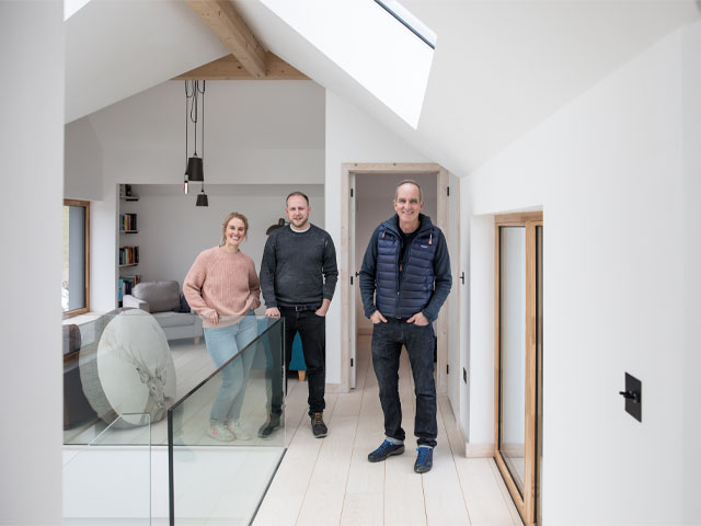 Grand Designs The Streets. Kevin McCloud white modern room glass balustrade industrial pendant light