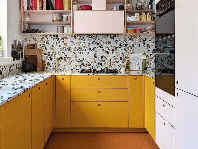terrazzo splashback yellow white cabinets recessed handles high shelving