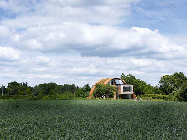 Grand Designs: Living in the country. Semi-circle home living roof viewing window large field