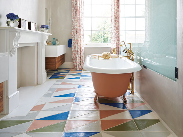 vintage bathroom peach freestanding bath large blue splashback white fireplace green blue and peach triangular floor tiles