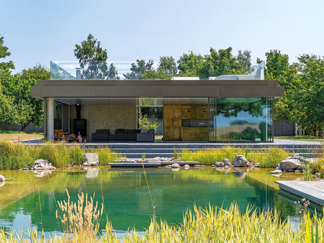 swimming ponds. glazed pool house with open plan kitchenette and roof terrace with glazed balustrades