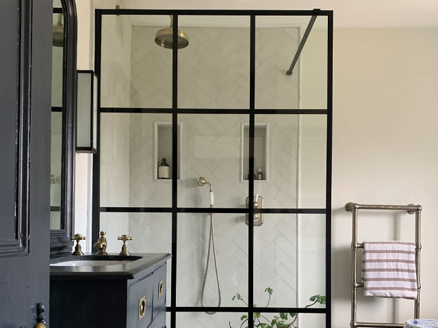 vintage bathroom beige walls blue door blue sink unit gold taps crittall style shower screen silver towel rail