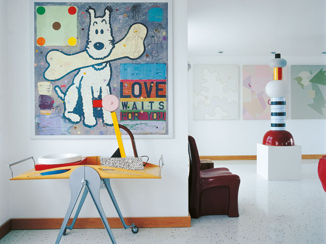White home interior colourful artwork cartoon dog large bone maroon chair