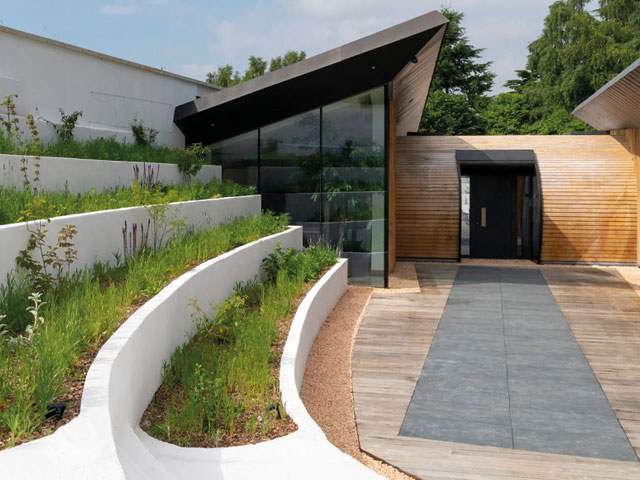 Dorran and Vereuschka house in Canterbury is covered with specially blended earth to support the live roofs plus a range of shrubs and meadow plants. Photo: Jefferson Smith