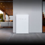 A Tesla powerwall fixed to an outside wall