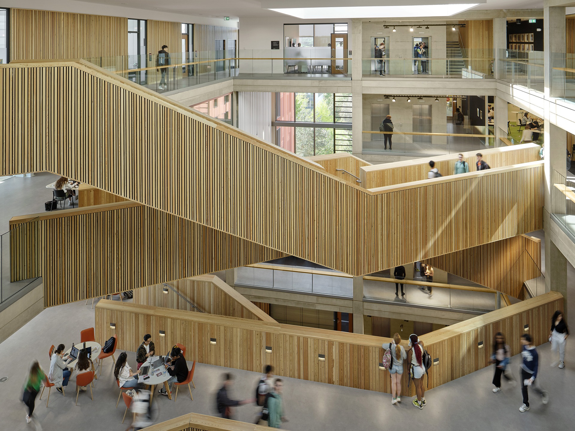 staircase in a large building with lots of students on it