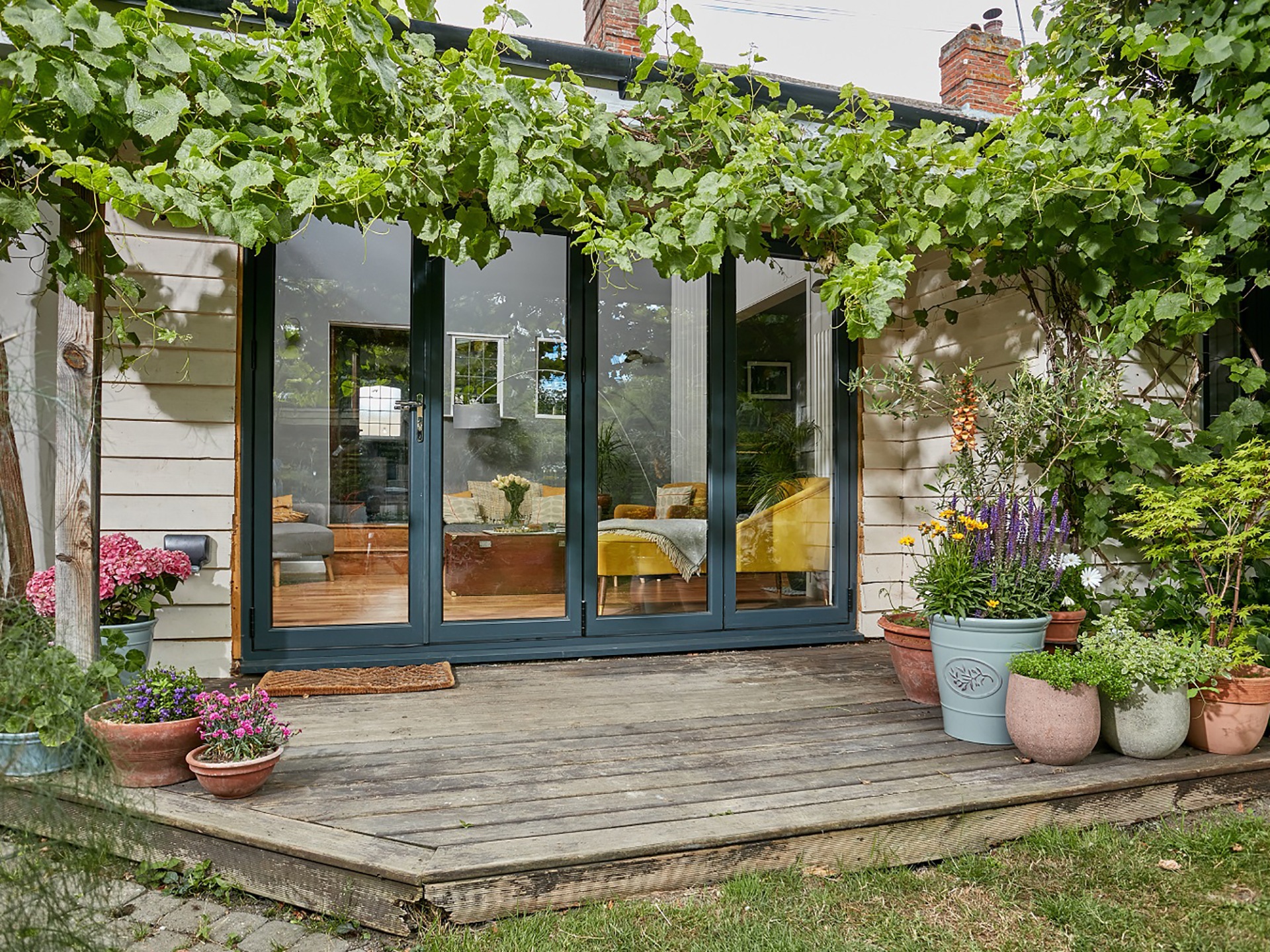 Bifold doors installed in a kitchen, view from outside