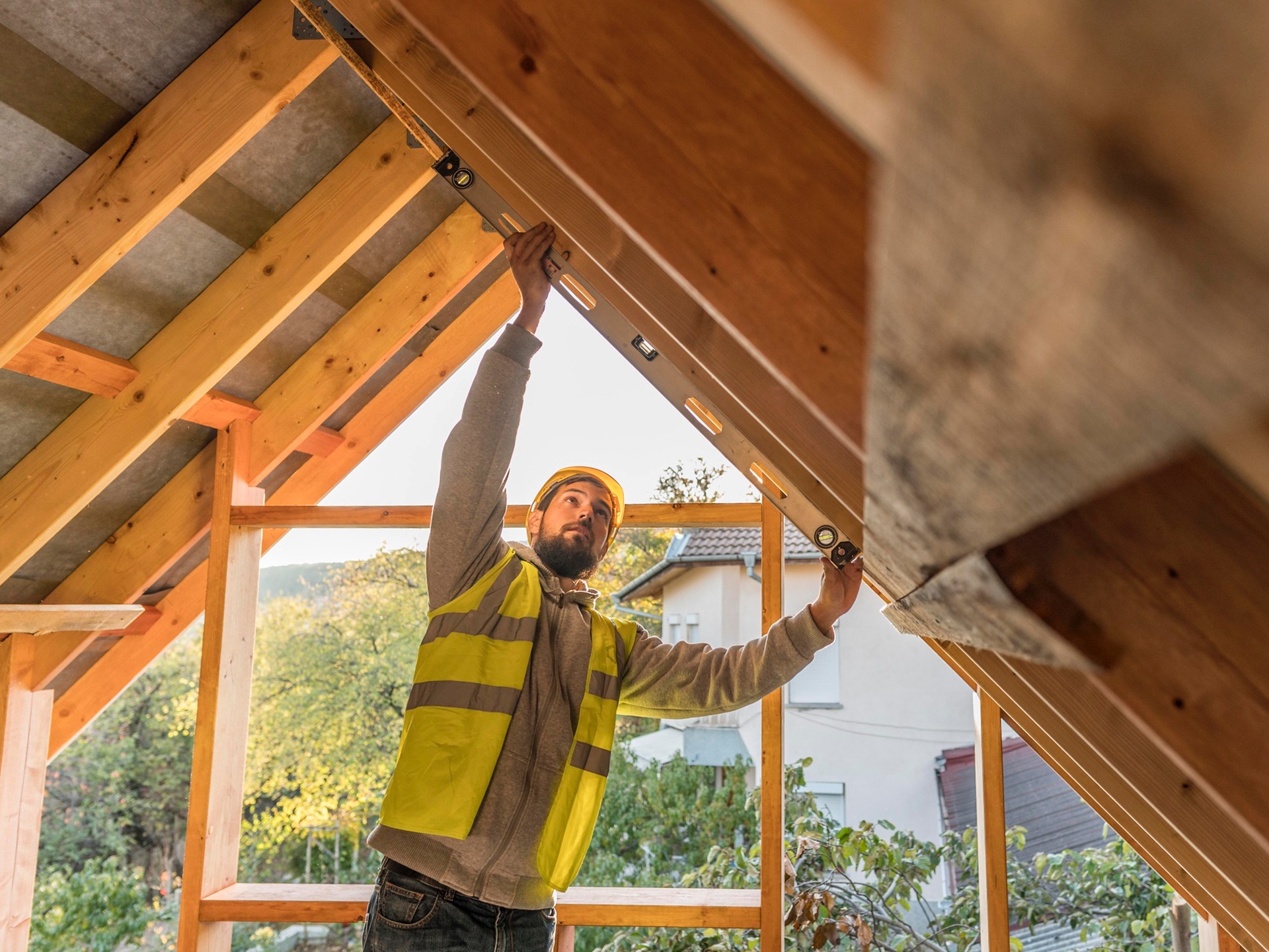 A carpenter working on a roof