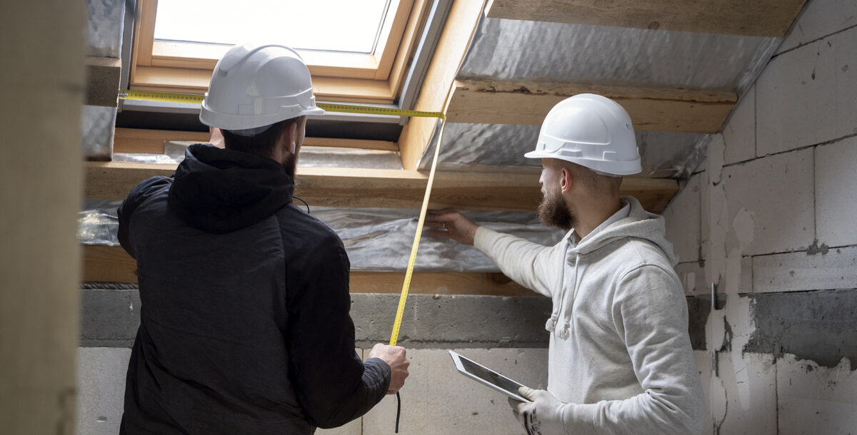 ghost house grand designs Men working in a roof