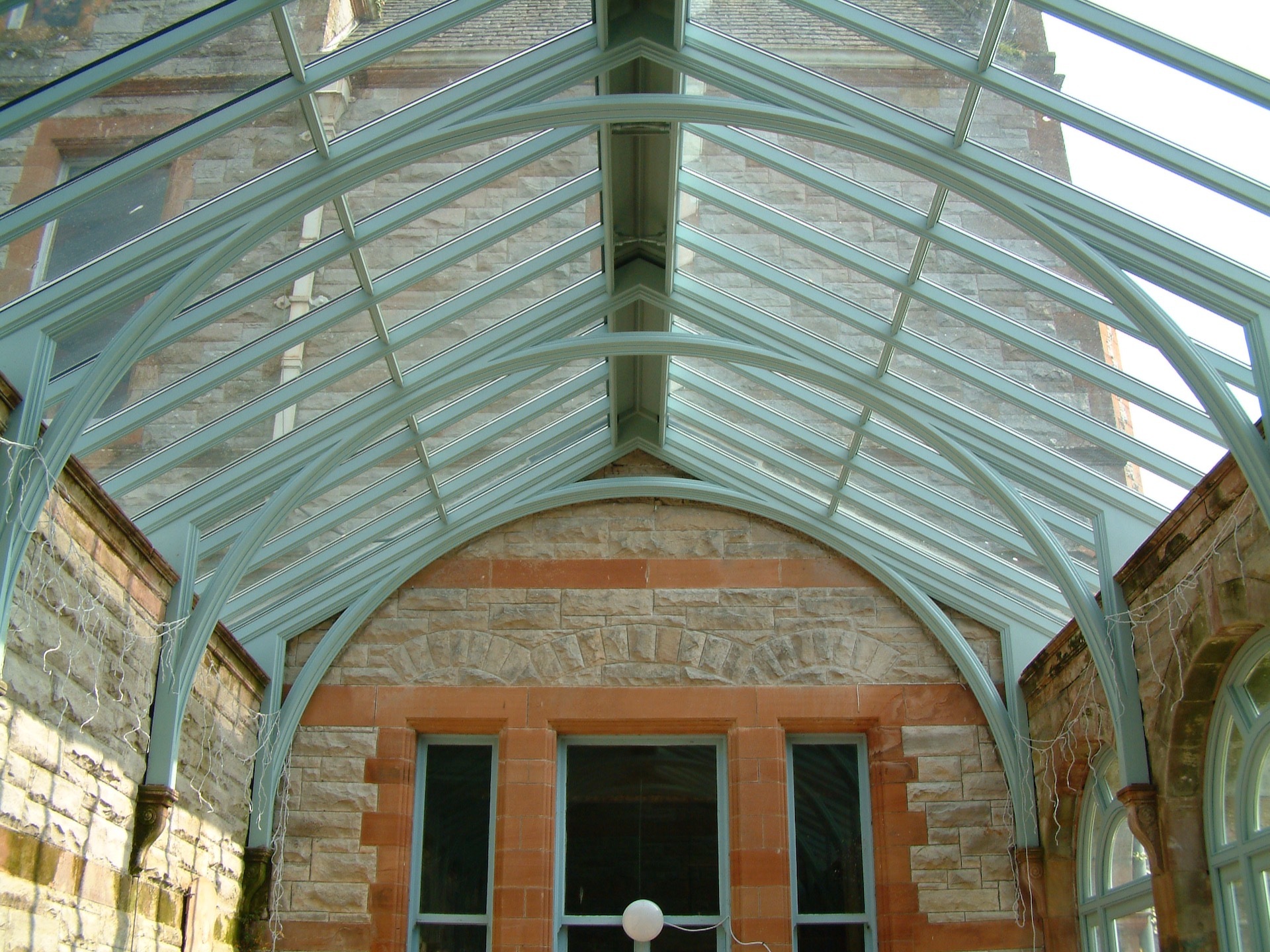 Powder blue pitched conservatory roof by Hampton Conservatories