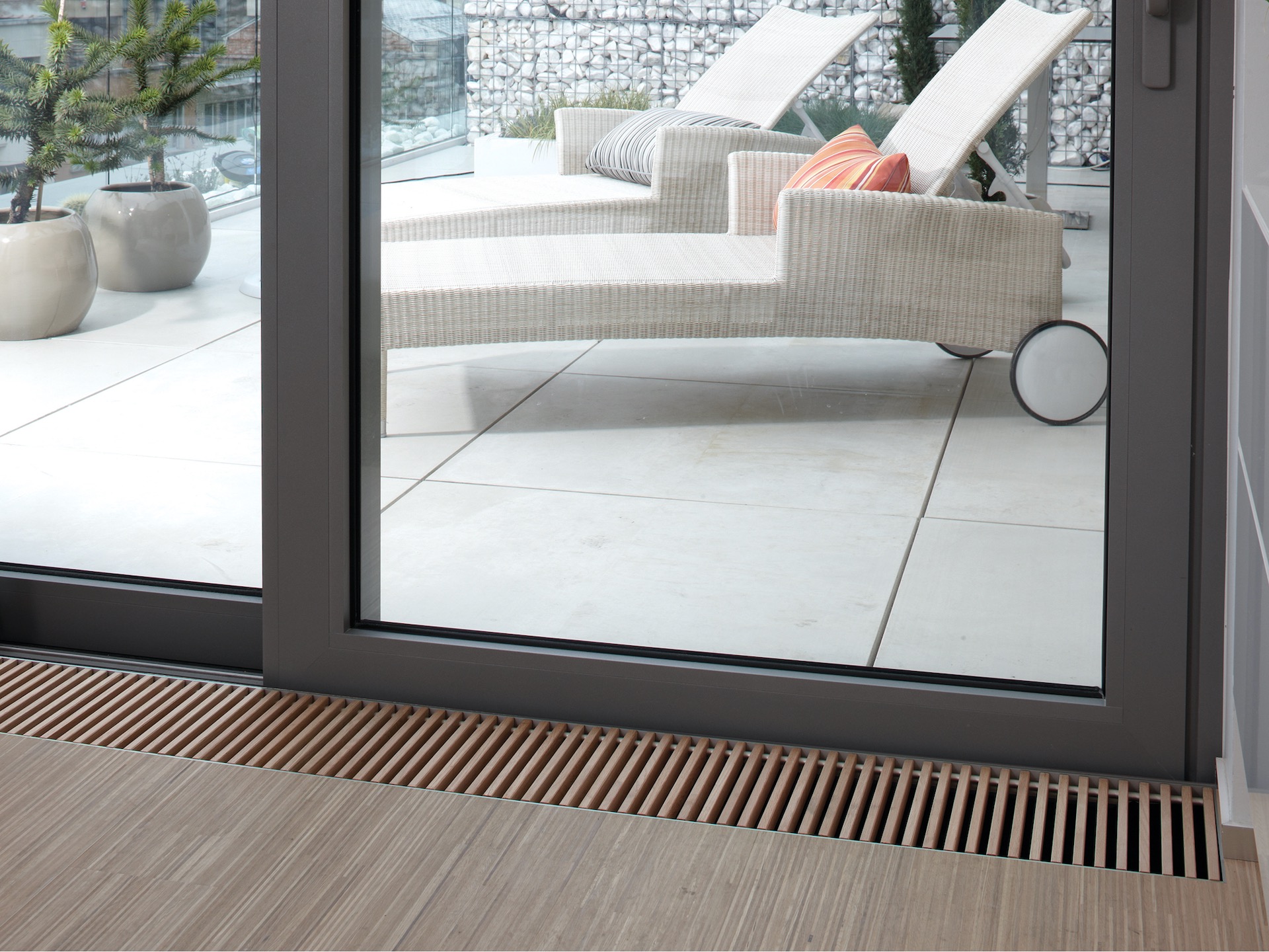 Fan assisted trench heating next to sliding patio doors