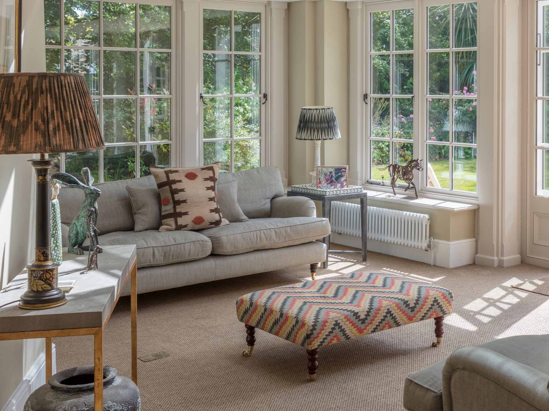 Conservatory with window seat, sofa and footstool