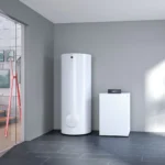 A ground-source heat pump and water cylinder in a utility room