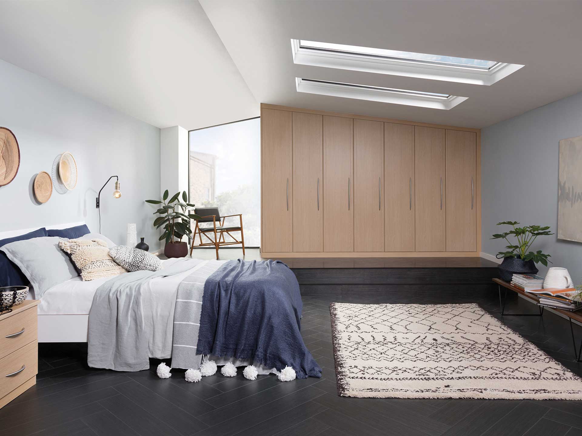 Look out to the passing clouds from your bed with the perfectly pitched skylight