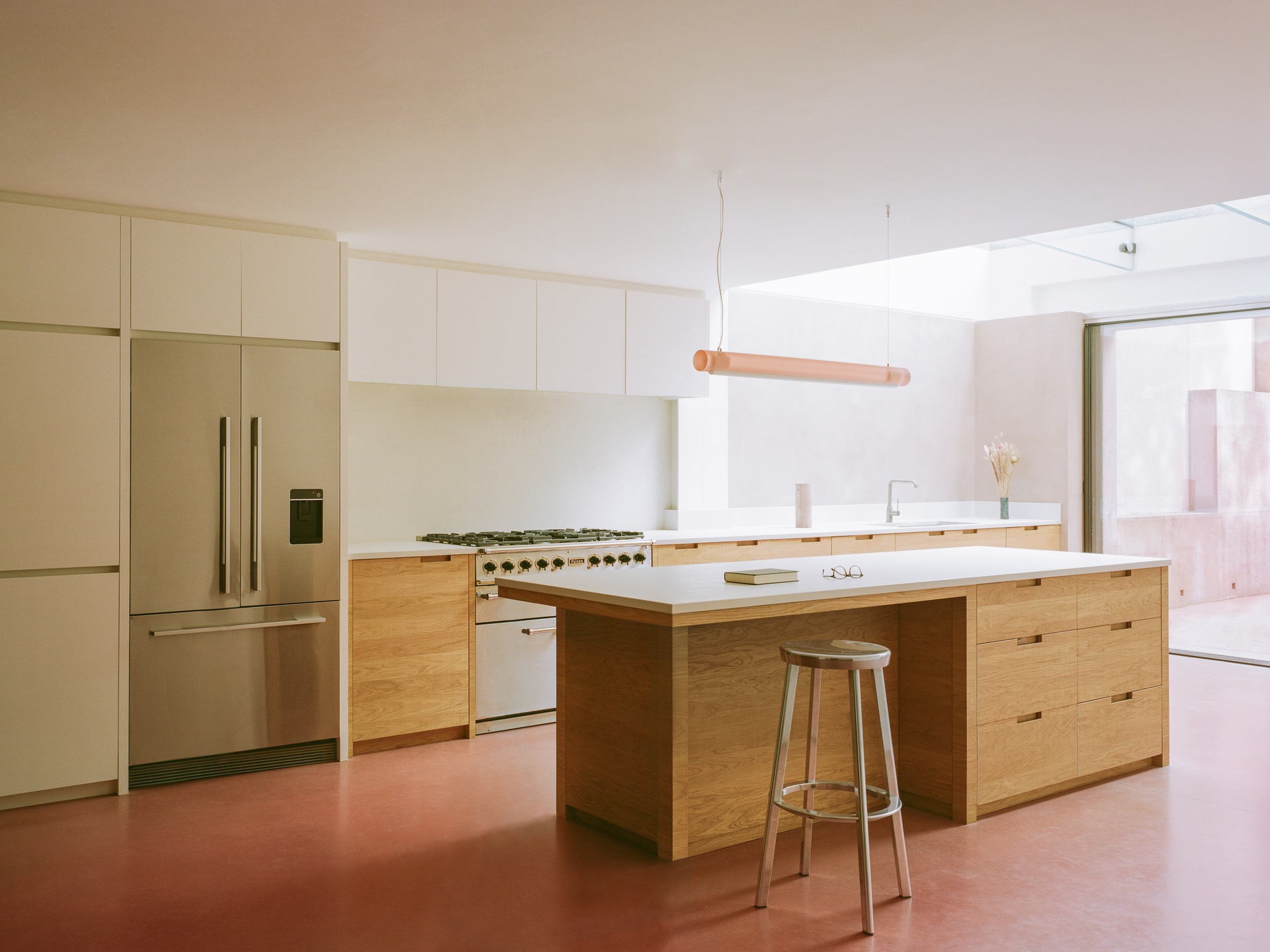 An open plan kitchen designed by Unknown Works