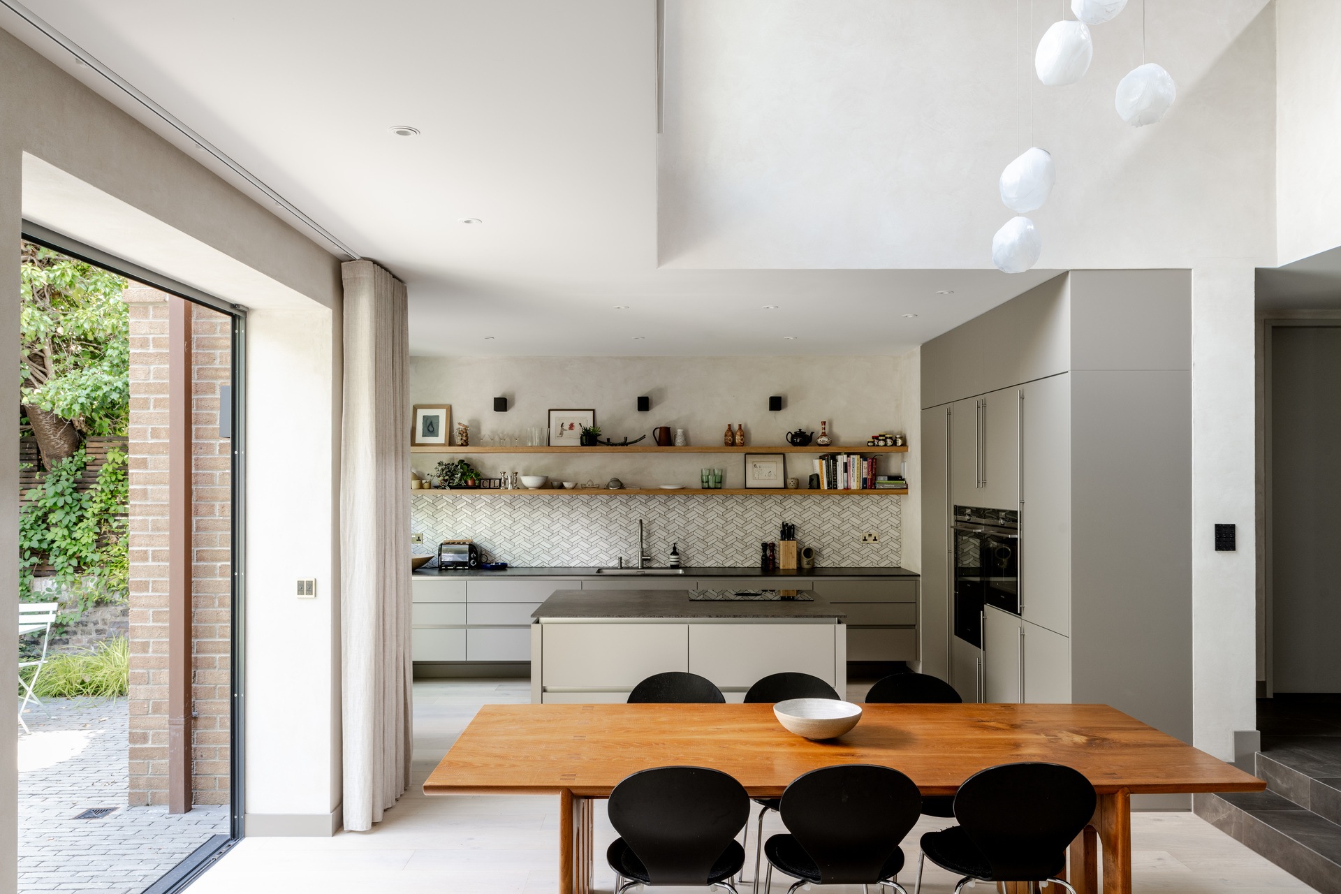 A double-heightvoid and generous open-plan living space is the result of opening up the ground floor at the back of this 185sqm, two-bedroom house in Belsize Park, north London. 