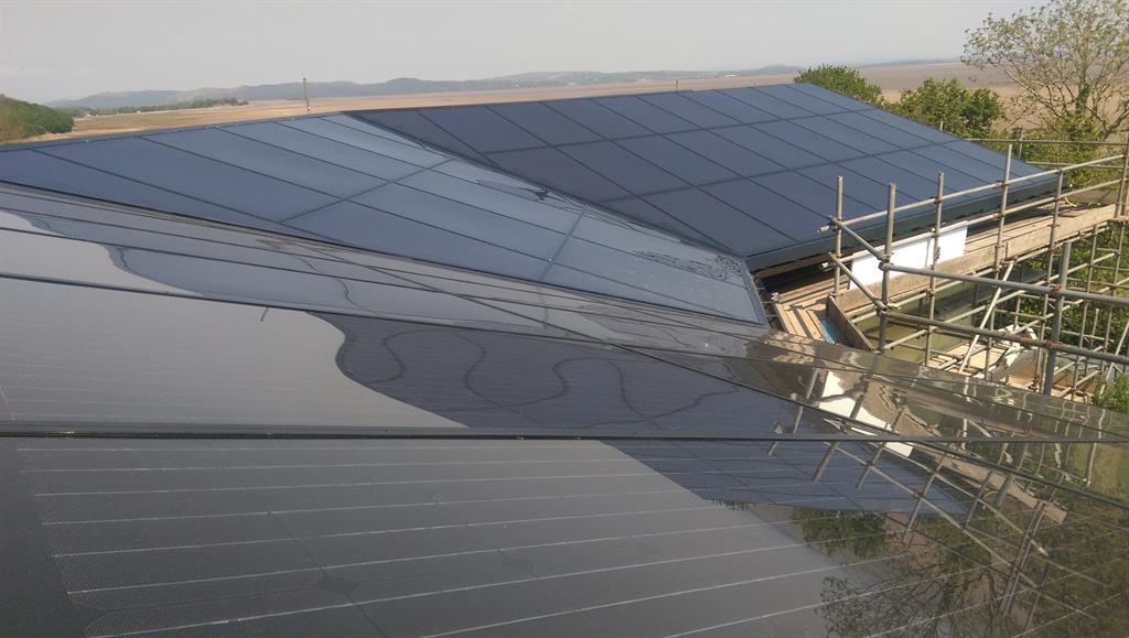 A GB-Sol Infinity Solar Roof, showing rectangular and triangular panels on a roof with three aspects