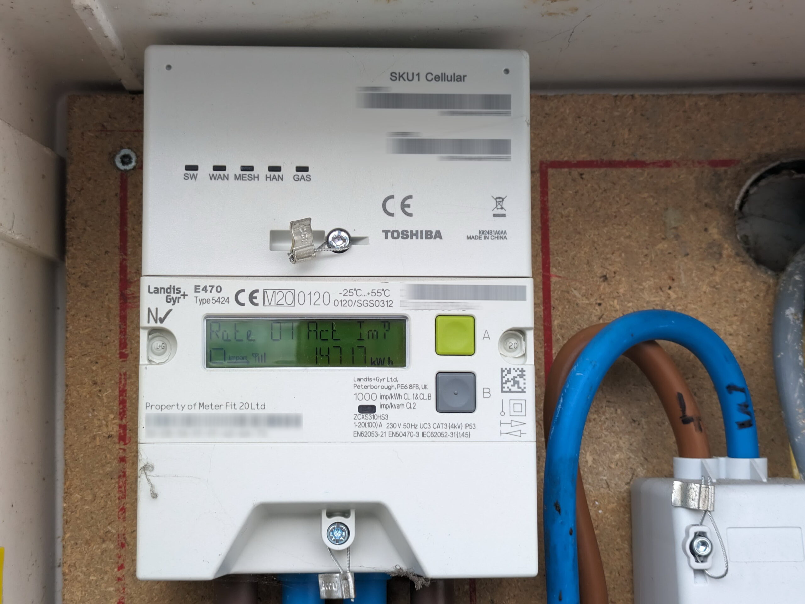 Photo of a smart meter in a meter cupboard