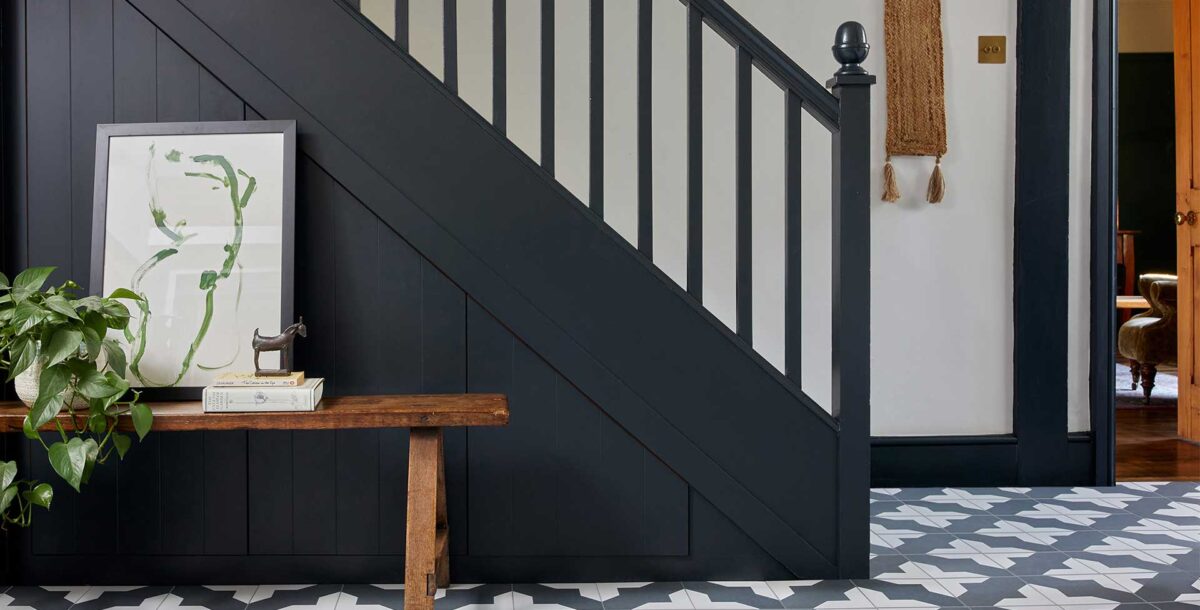 The stair decorating idea of painting the bannisters black will bring a dramatic update