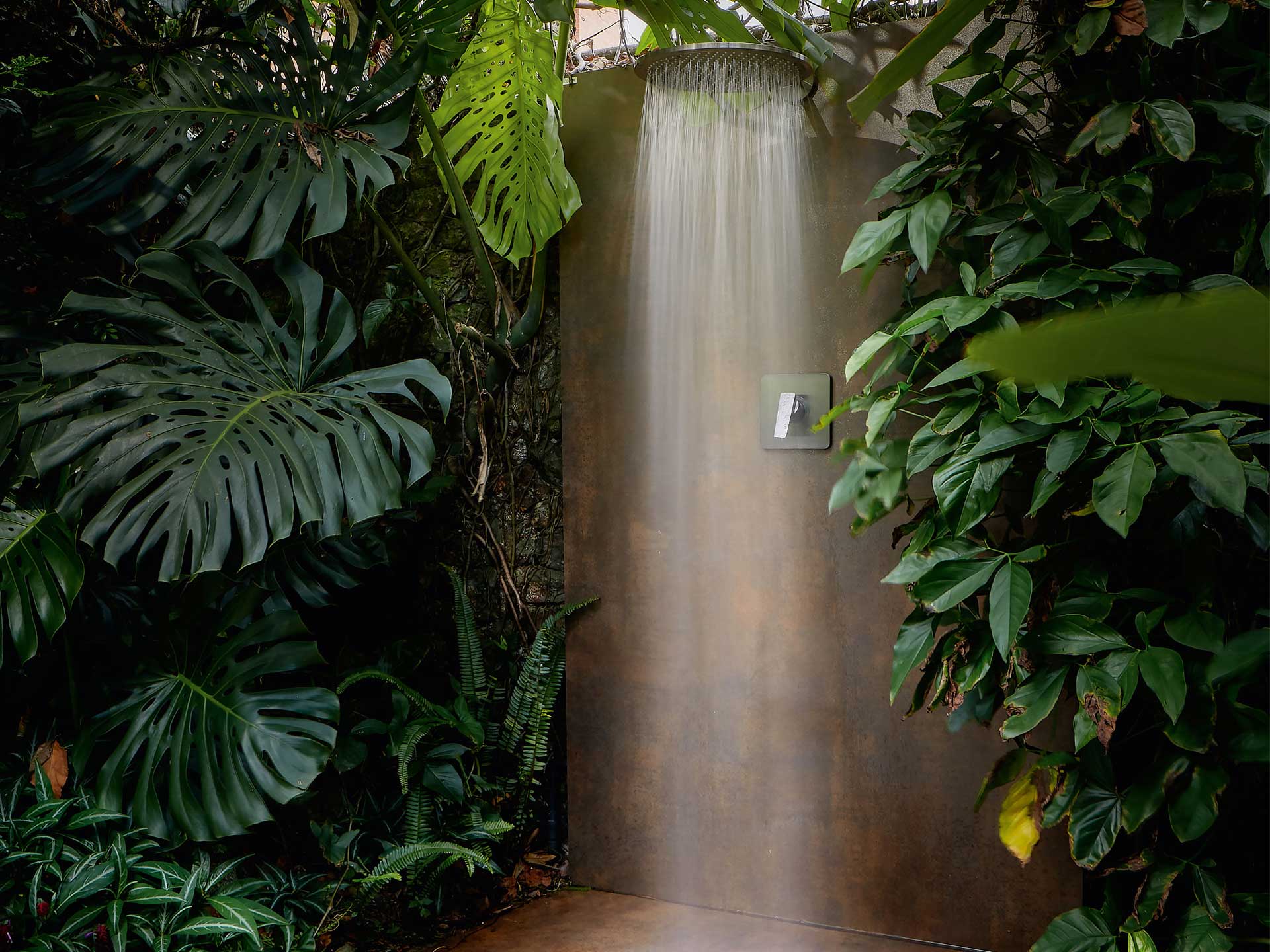 Creating a secret outdoor shower will bring a holiday vibe to your garden