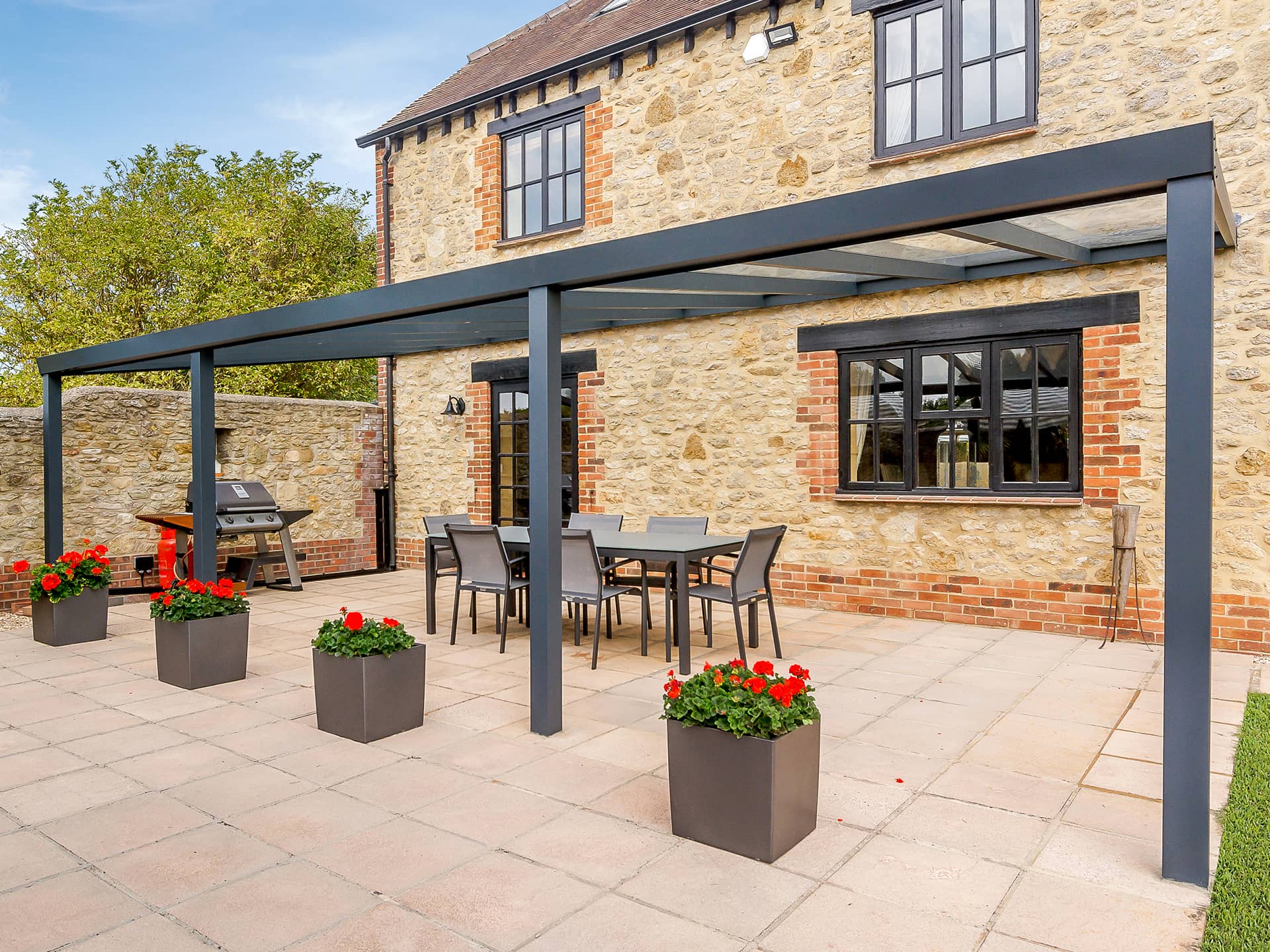 black veranda in front of old fashiond house