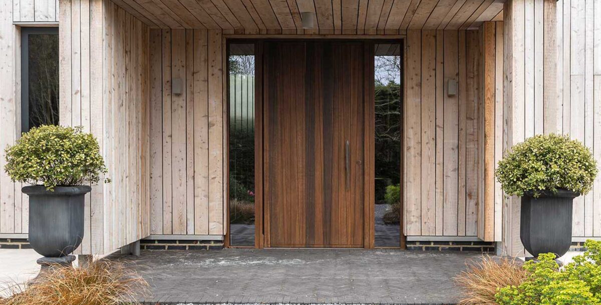 A built in porch with an overhang and side lights