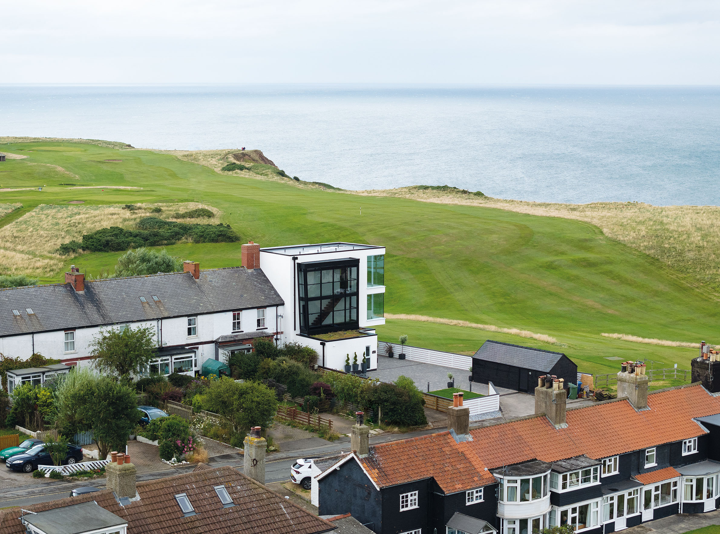 The house is next to a golf course and at the end of a terrace of heritage homes