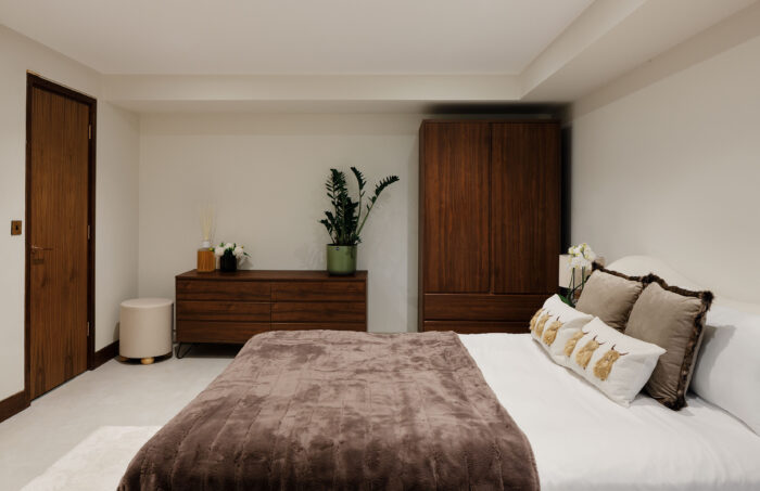 The upside-down layout includes two guest bedrooms at ground-floor level